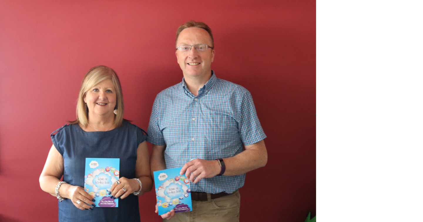 Margaret Yarr, Child Protection Officer for Northern Ireland, and Dr Peter Hamill, Secretary to the Church of Ireland Safeguarding Board, with the new guidelines leaflet for faith&ndash;based groups on the use of social media and other online communication.