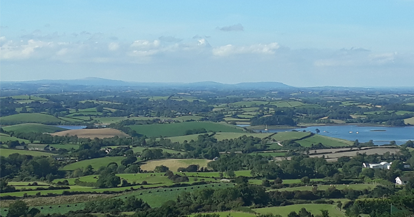 The County Down countryside, along the shores of Strangford Lough, rolls out from Slieve Patrick.