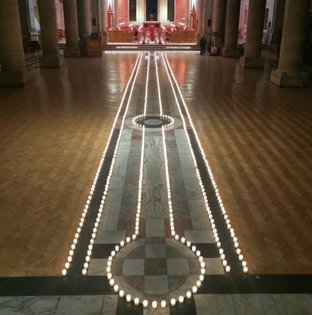 Candles burn for Covid lives lost