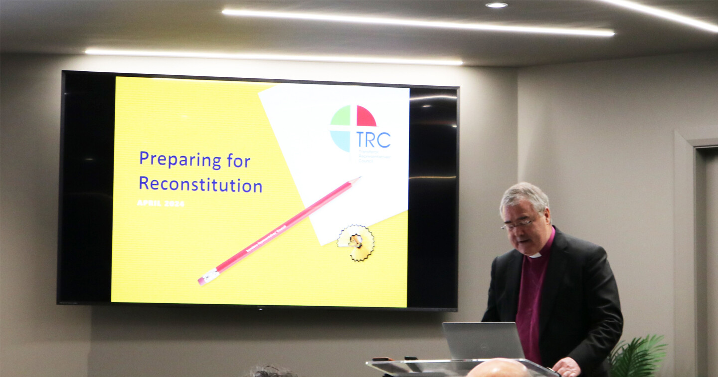 Archbishop John McDowell opens the Lisburn event in prayer.