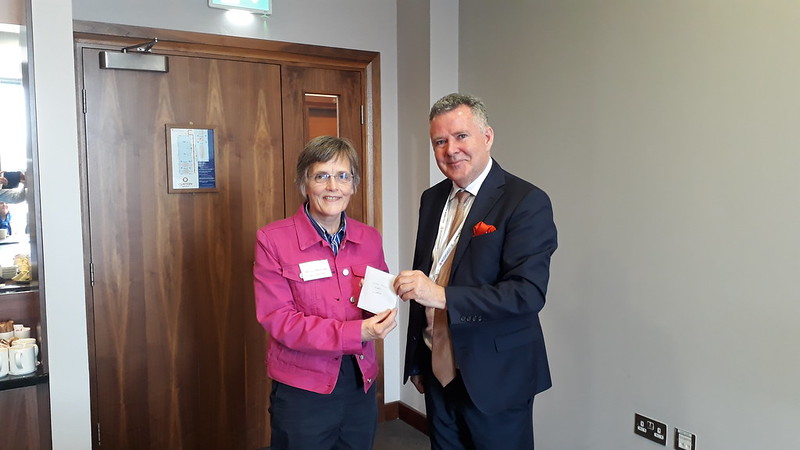 Winning parish magazine editor Gillian Burke accepts her prize.