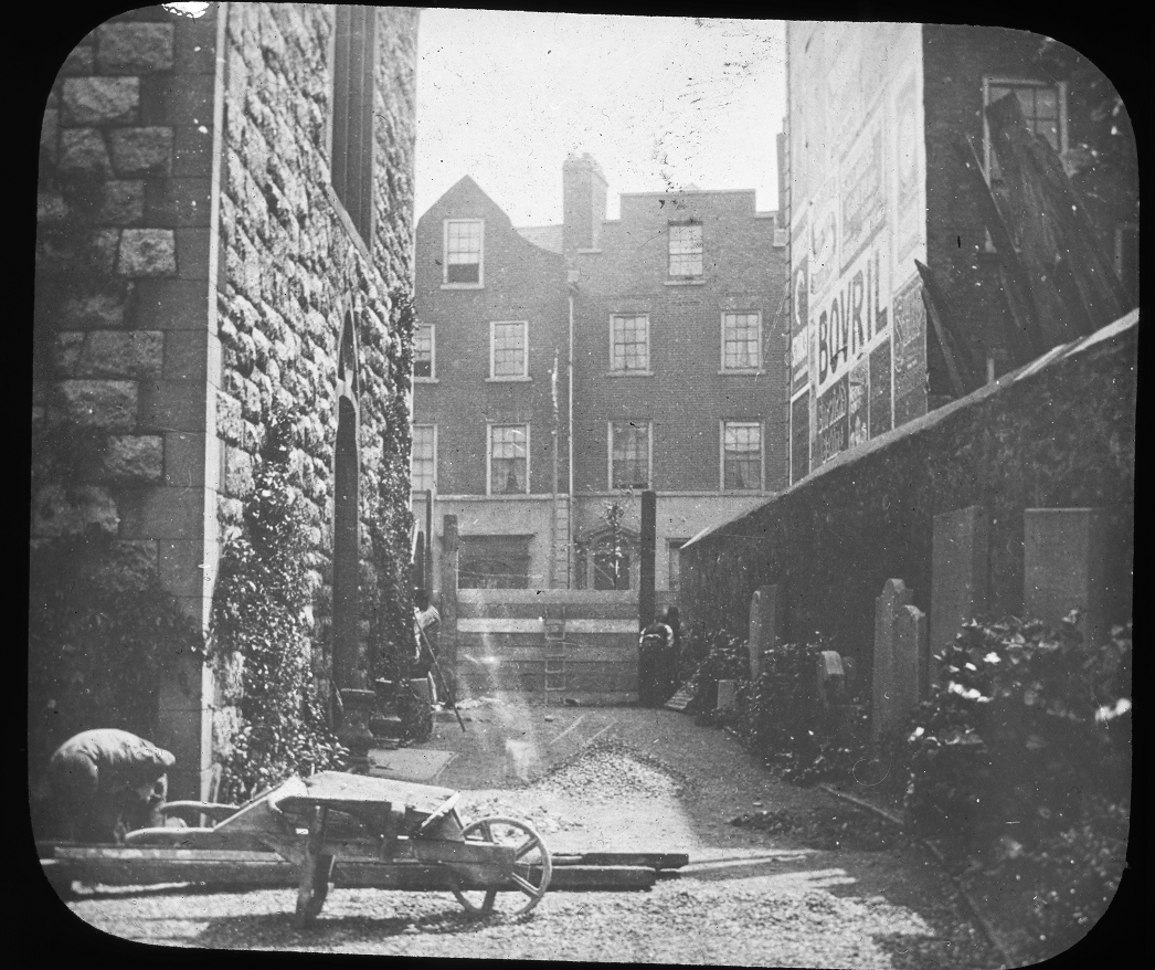 This image shows the southern wall of St Peter's, with an interesting view of the east side of Aungier Street and some buildings that once stood here (and in the example of the building on the left, still stand, but in a much altered form).