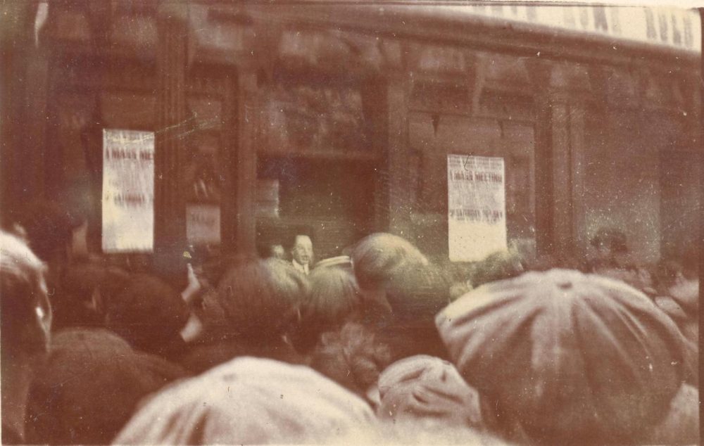 View from the crowd as Edward Carson address a rally &ndash; mostly likely an anti-Home Rule event judging by the just visible text in the top right hand corner, and also the notice of a &ldquo;mass meeting&rdquo; beside him, RCB Library MS 295