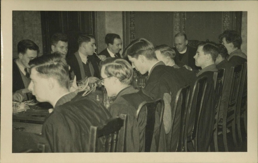 Figure 7. Photograph of Michael Ferrar at the head of the dining table in the Divinity Hostel - MS 1182.2