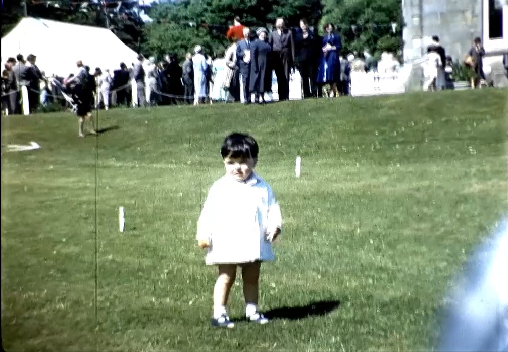 Figure 6. Child outside Murlough House [Stills taken from 16mm Cinefilm RCB Library]