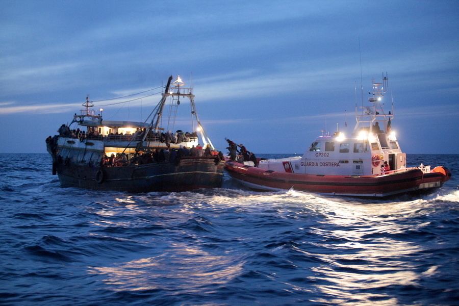A rescue of migrants and refugees bound for Europe in 2014. Photo credit and copyright:  International Organization for Migration (IOM)/Francesco Malavolta.
