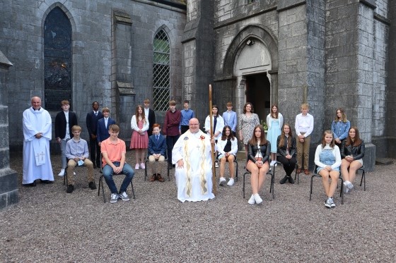 The Confirmands with their Rector, the Ven Adrian Wilkinson (left), and their Bishop, the Right Rev Dr Paul Colton (middle).