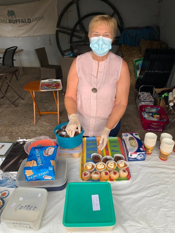 Ivy Dennis selling homemade cakes.