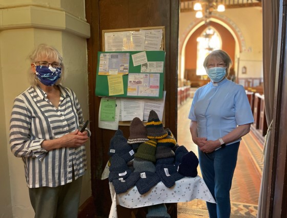 Marcia Apelbe, one of the knitters, and the Rev Hazel Minion.