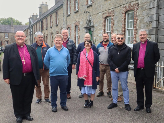 From left to right: Bishop Paul Colton, Pat Brennan, Denis McGrath, Billy Skuse, Fiona Finn, Alan Dowling, Nick Haulburt, Morgan McDonogh, Charlie Daly, and Archbishop John McDowell at Ki*ngston College.