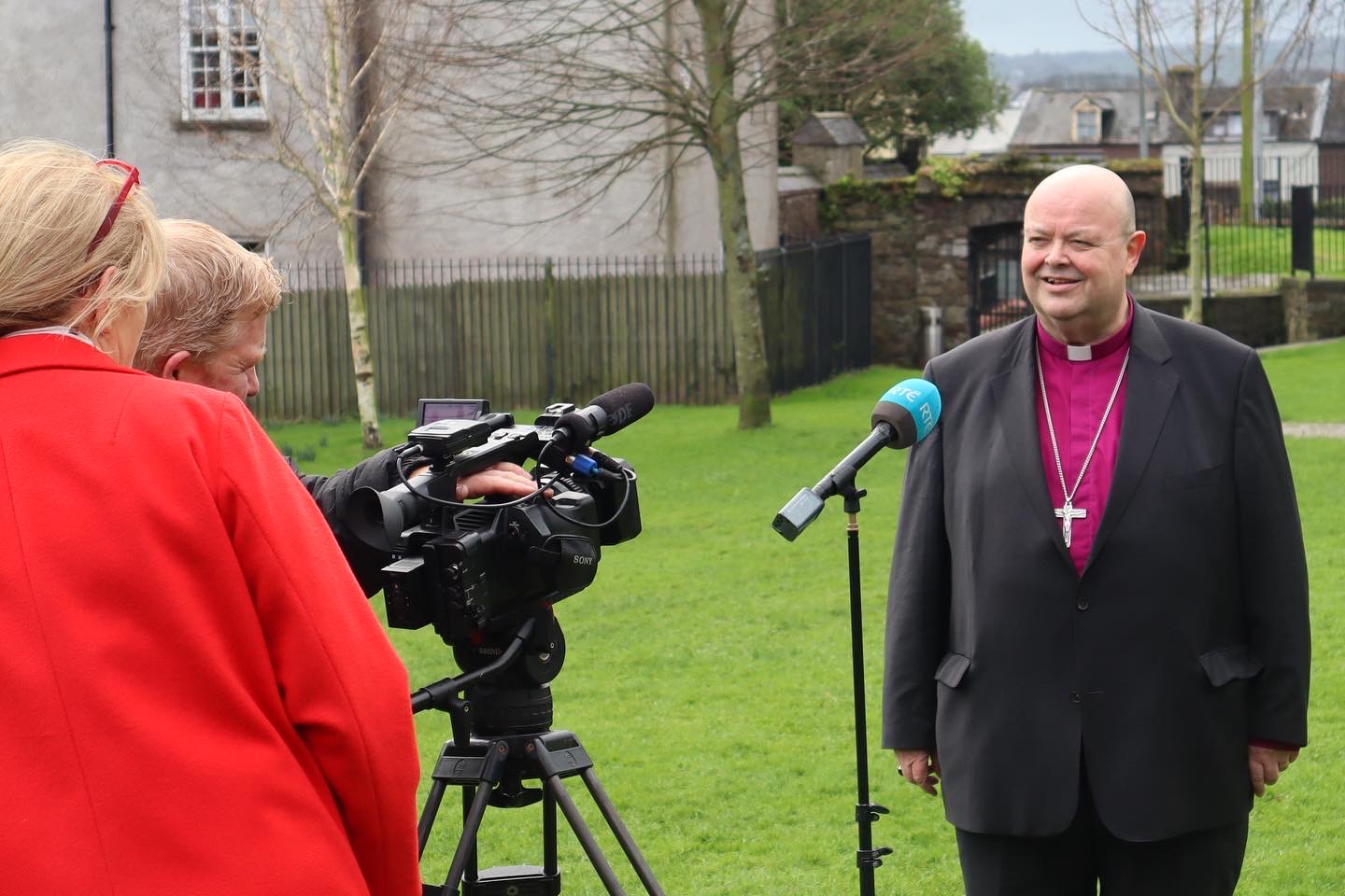 Bishop Paul giving an interview to RT&Eacute; in the ground of Saint Anne's Church, Shandon.