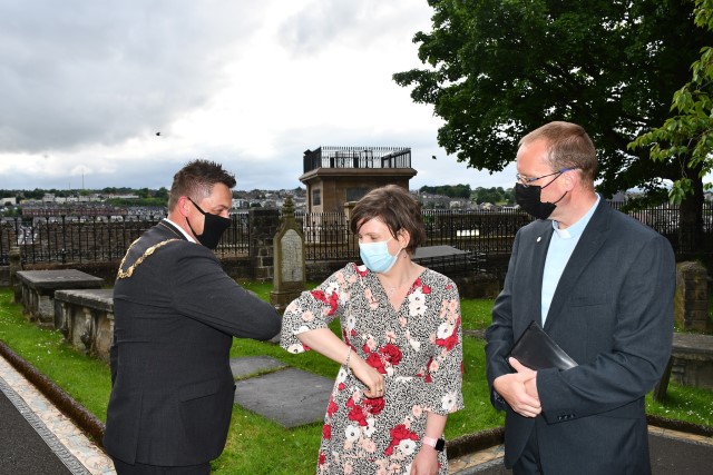 Mrs Alison Cairns welcomes Mayor Alderman Graham Warke as Rector Nigel Cairns looks on.