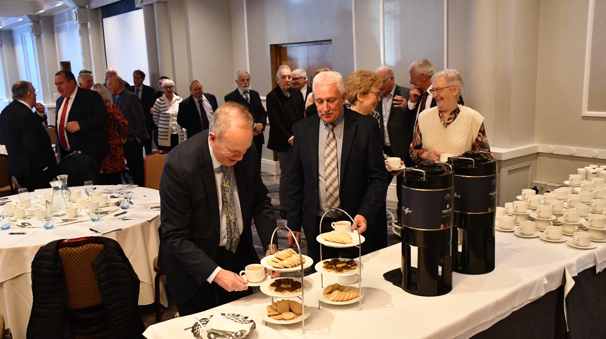 Synod members enjoy fellowship and refreshments at their annual gathering.