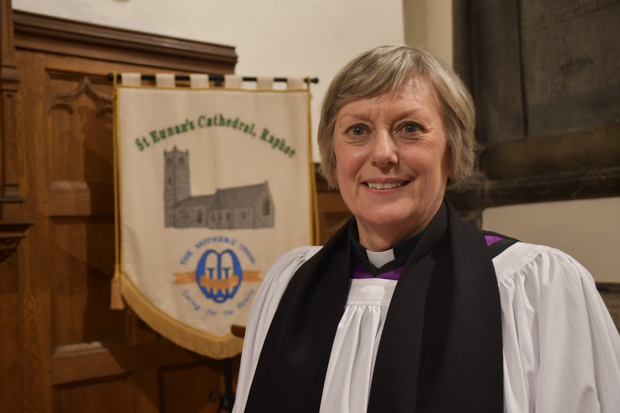 Dean Fitzgerald with the banner of St Eunan's Cathedral Mothers' Union.