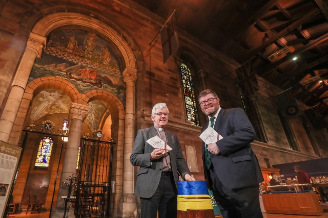 Mr Crozier and Dean Forde with the Black Santa barrel, in use for the current sit-out fundraising appeal for Ukraine.