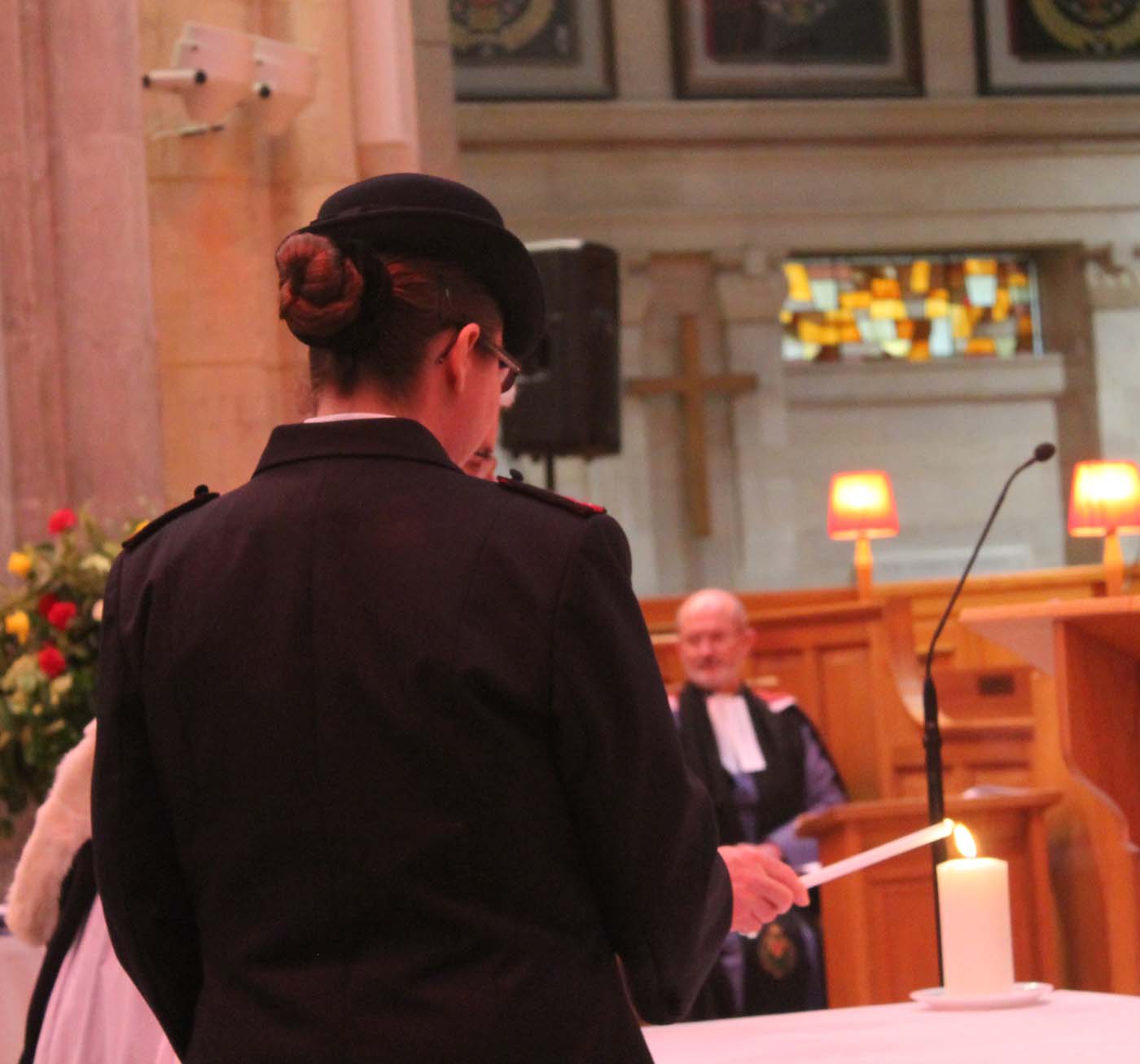 Lighting a candle in Belfast Cathedral at the service on January 29 to commemorate the lives lost when the MV Princess Victoria floundered.