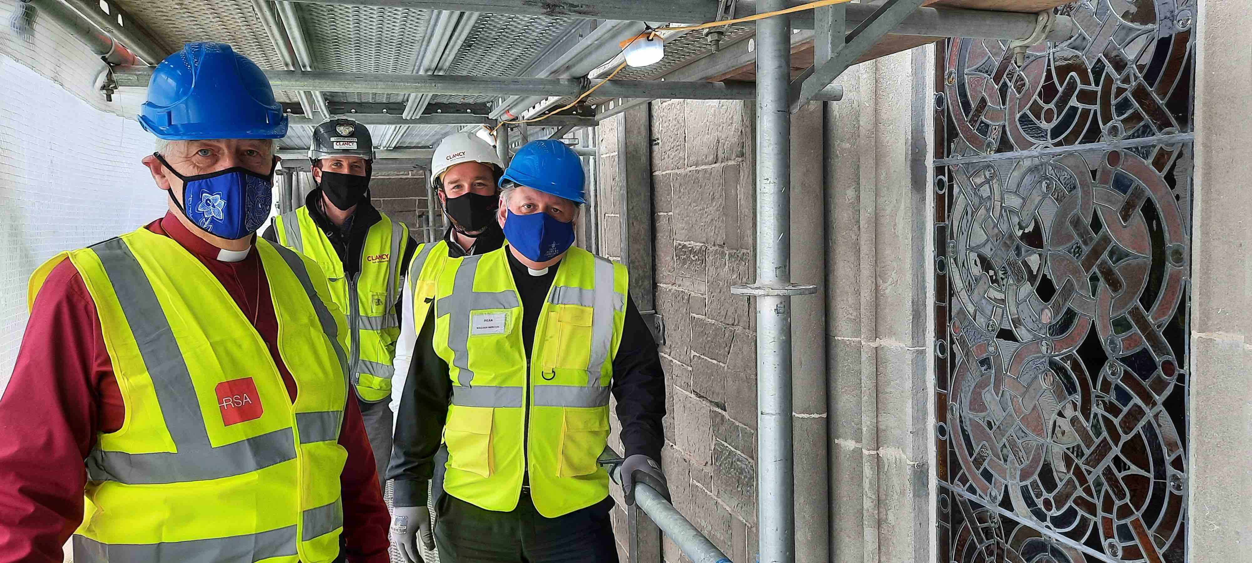 Inspecting reinstalled Clerestory windows are Archbishop Michael Jackson, Lorcan Hickey, site manager with Clancy, Ian Morrissey, contracts manager with Clancy, and Dean William Morton.