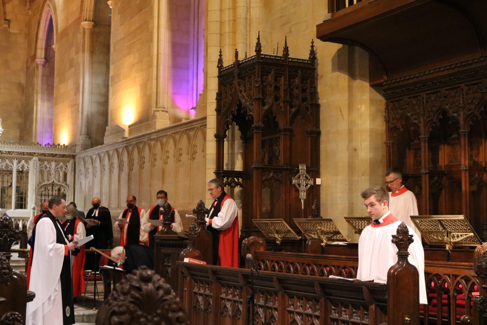 Dean Shane Forster installs Archbishop John McDowell at his throne in St Patrick's Cathedral, Armagh.