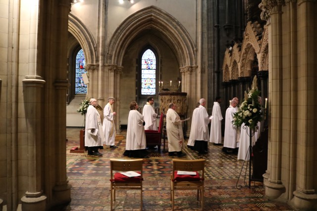 Members of the clergy process.