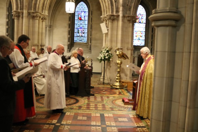 Sponsors present the Bishop-elect to Archbishop Jackson.