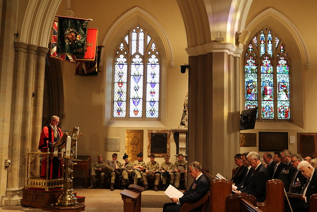 Alderman Kyle Savage, Deputy Mayor of Armagh, Banbridge and Craigavon, reads an excerpt from King George VI's speech.