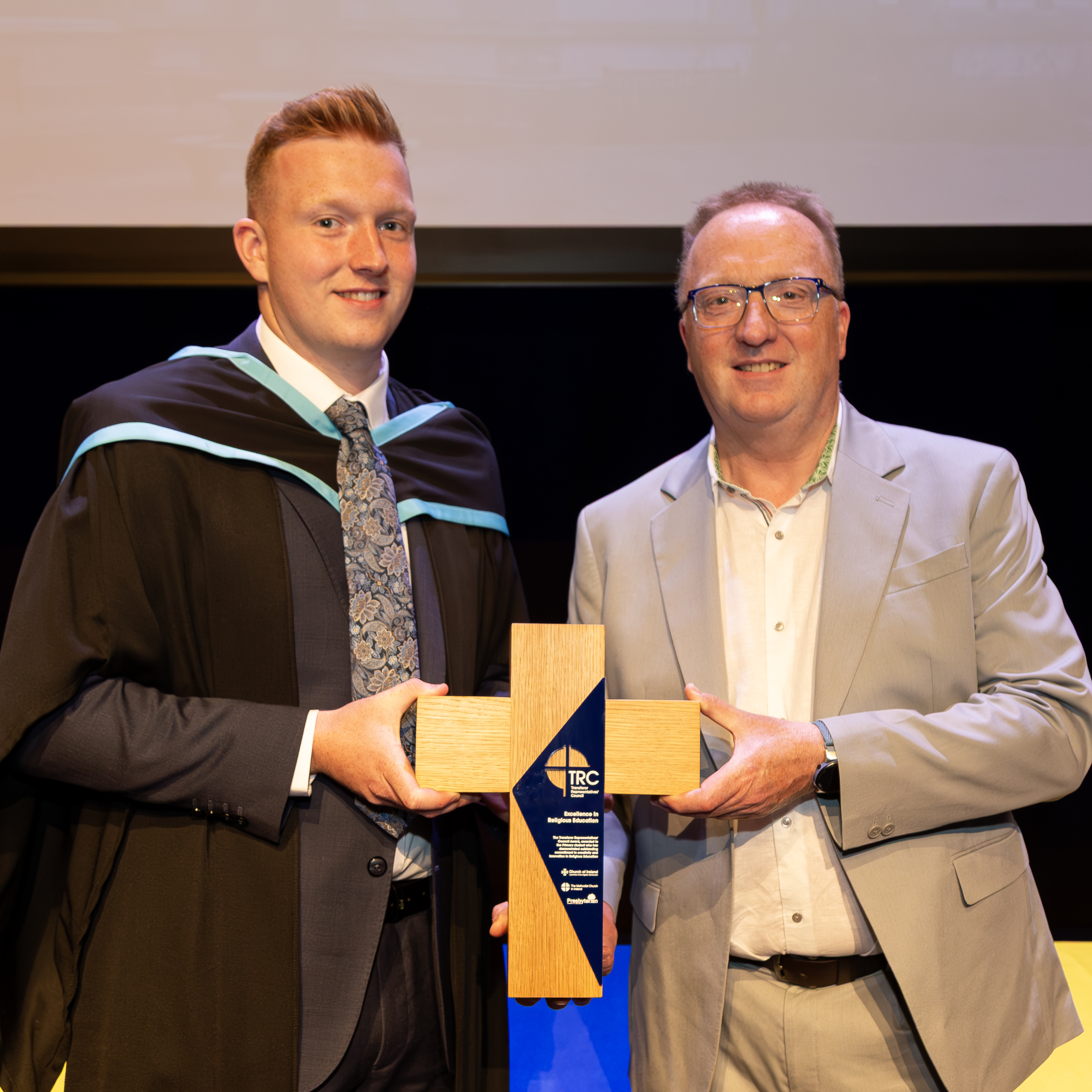 Lewis Getty receives the 2025 TRC Award from Dr Peter Hamill, Secretary of the Transferor Representatives' Council.  Photo credit: Graeme Watson/Stranmillis University College.